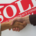business people seal contract for sale with a handshake.