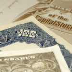 photo of various stock certificates - financial concept